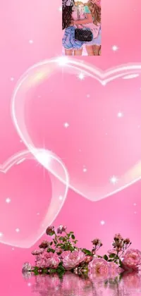 This live wallpaper features two women standing in close proximity against a vibrant pink background with multiple scattered hearts and a bubble effect