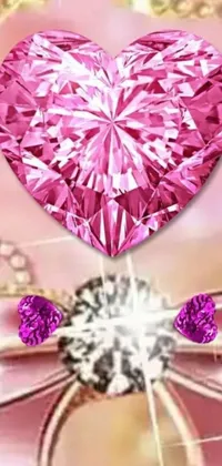 Get ready to add some serious sparkle to your phone with this stunning pink heart-shaped diamond live wallpaper