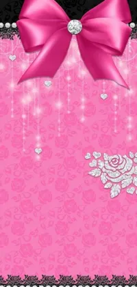 This live phone wallpaper features a trendy pink background adorned with pearls and a bow