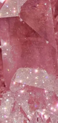 Get mesmerized by the pink crystal and surrounding fairy dust on this live phone wallpaper