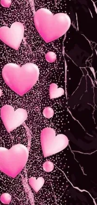 This phone live wallpaper features a cheerful design of pink hearts against a black backdrop