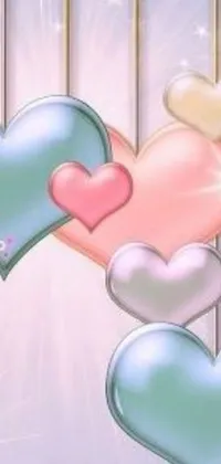 This live wallpaper features an adorable design of pastel colored heart-shaped balloons dangling from a wire against a beautiful background picture by Tumblr user Shirley Teed