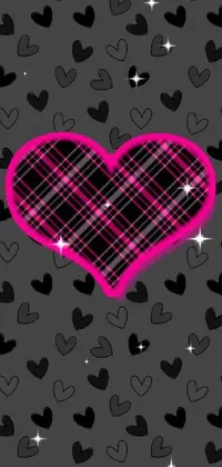 Looking for a stylish and beautiful live wallpaper? Then check out this amazing black and pink heart design! Featuring a bold, central heart and surrounded by smaller, digital-scale hearts, this wallpaper is sure to make a statement