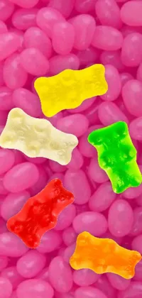 This live phone wallpaper features a flavorful mix of jelly beans and gummy bears in bright hues