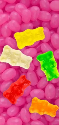 This live phone wallpaper features a flavorful mix of jelly beans and gummy bears in bright hues