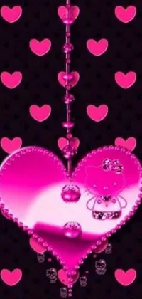 Looking for a fun and playful phone live wallpaper? Look no further than this pink heart-themed wallpaper! Featuring a striking black background, this wallpaper is adorned with a large pink heart in the center surrounded by smaller hearts and complemented by deviantart artwork and a cute Hello Kitty icon
