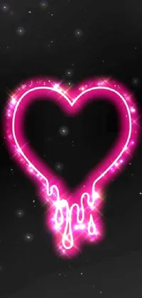 Decorate your phone screen with a stunning heart-shaped neon sign wallpaper
