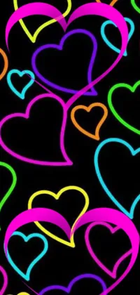 This phone live wallpaper features neon hearts of various colors floating on a black background