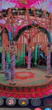 Experience the vibrancy of a stunning mandap adorned with an array of flowers and garlands in this breathtaking live wallpaper