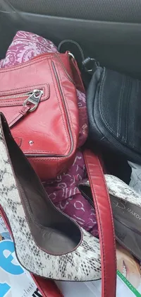 This lively and captivating live wallpaper showcases a jumbled collection of purses and shoes stacked in the back seat of a car