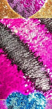 The phone live wallpaper is a stunning display of a bag adorned with sequins in hot pink and black colors