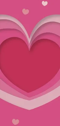 This pink phone live wallpaper features a cut-out heart made of paper with intricate details and clean lines