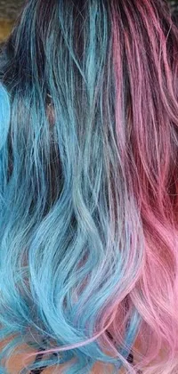 This aesthetically pleasing live wallpaper displays an attractive image of a woman's head with a unique combination of blue and pink hair, boasting a pastel color scheme and blue-pink color palette