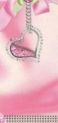 This gorgeous phone live wallpaper showcases a stunning pink card adorned with a ribbon and heart design