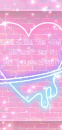 This phone live wallpaper features a heart-shaped neon sign on a brick wall with a Tumblr and graffiti aesthetic