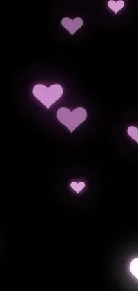 This phone live wallpaper features a stunning display of hearts floating in the air in blacklight aesthetic with a Tumblr-like theme of romanticism