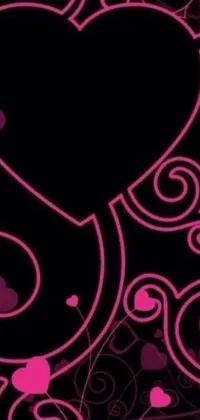 This phone live wallpaper features a unique and bold design with a black background adorned with pink heart and swirl patterns in an Art Nouveau-inspired style