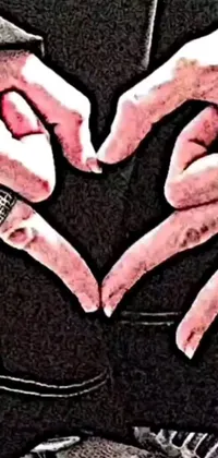 This phone live wallpaper showcases a close-up of two people holding hands in the shape of a heart