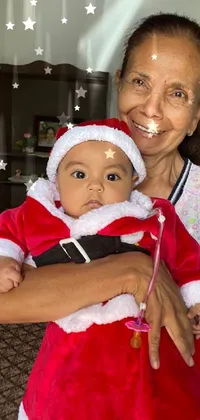 This festive live wallpaper features a jolly Santa baby cradled in a woman's arms wearing a Santa suit