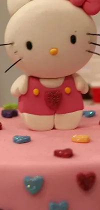 Introducing an adorable Hello Kitty cake live wallpaper for your phone! This vibrant and colorful wallpaper showcases a mouth-watering cake with intricate claymation design in a full body shot closeup view