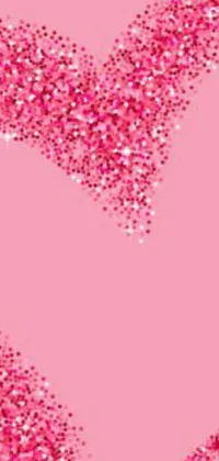 This live wallpaper for phones features a stunning pink glitter heart set on a matching pink background