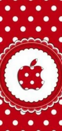 This phone live wallpaper boasts a lively, red and white polka dot background with a prominently-placed, reddish gradient apple icon