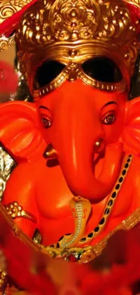 Experience the beauty and elegance of a striking close-up of a majestic statue of an elephant wearing red and orange attire, proudly displayed on an altar