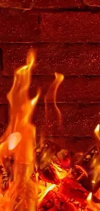 This phone live wallpaper features a high-definition rendering of a brick wall with a vibrant fire burning in the foreground