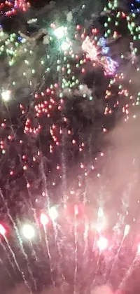 This live wallpaper features a stunning display of colorful fireworks bursting in the night sky