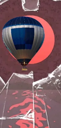 This phone wallpaper depicts a hot air balloon as a digital painting in the sky with vibrant colors
