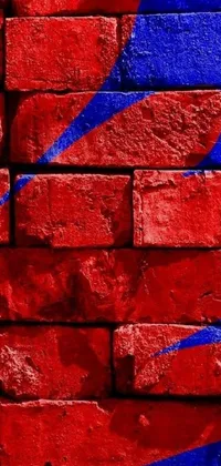 Looking for a lively and energetic phone wallpaper that reflects your love for music, sports, art, and city vibes? Check out this vibrant live wallpaper featuring a brick wall with a heart painted on it, an album cover, spiderman in the moshpit, FC Barcelona logo, and a city skyline in the background