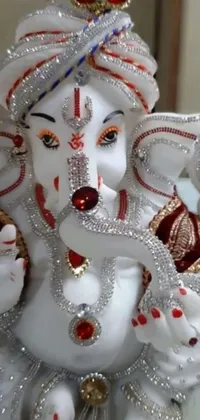 This mobile live wallpaper showcases a beautifully detailed marble elephant sculpture surrounded by various emojis