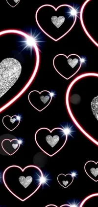 This stunning phone live wallpaper features a collection of glimmering hearts set on a black background, adding a touch of elegance and romance to your device