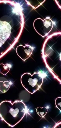 This live phone wallpaper design by Florianne Becker features glittering hearts on a black background