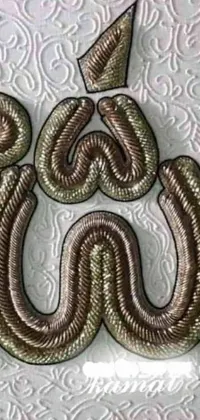 Experience the beauty of this exquisite phone live wallpaper featuring a close-up of a mesmerizing snake on a white surface