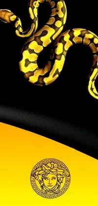 This phone live wallpaper showcases a vibrant, detailed close-up of a snake on a textured background in black and yellow