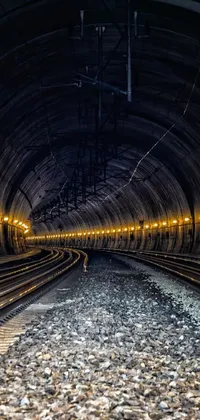 Transform your phone screen with this stunning live wallpaper featuring a dark and mysterious train tunnel