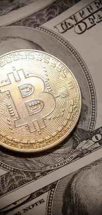 This engaging live phone wallpaper features a striking Bitcoin perched on top of a heap of money, including a Shutterstock watermark and a well-known photograph of American currency