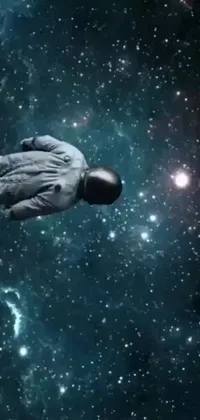 This live phone wallpaper features a man in a spaceman suit floating in a cosmic environment