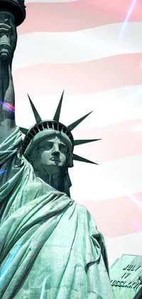 This phone live wallpaper depicts an awe-inspiring Statue of Liberty standing tall in front of an American flag