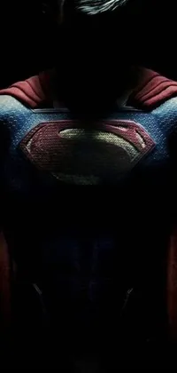 This live wallpaper features a man wearing a Superman suit standing in a dark background