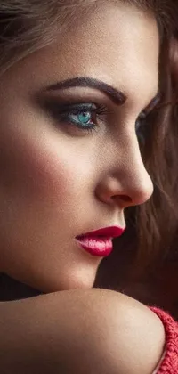 This phone live wallpaper features an ultra-realistic portrait of a woman with stunning brown hair, attractive eyes, and flawless skin, creating a bold contrast against her alluring red lipstick