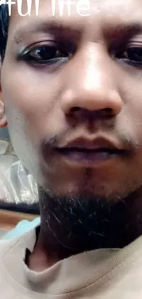 This phone live wallpaper showcases a person with a well-groomed beard, captured in a close-up selfie