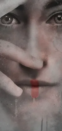 This phone live wallpaper depicts a close-up of a bloody face on a hopeless grey background