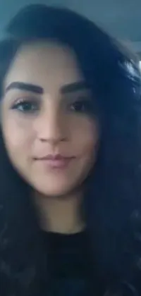 This close-up phone live wallpaper features a young Middle Eastern woman with long hair, created using tachisme art style