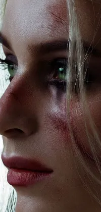 This phone live wallpaper shows a striking close-up of a woman with blood on her face in a hyper-realistic style