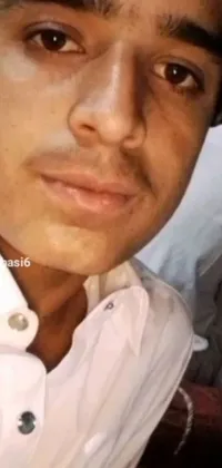 This stunning live wallpaper showcases a close-up view of a person wearing a white shirt