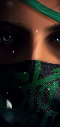 Looking for an edgy live wallpaper for your phone? This cyberpunk art inspired design features a close-up of a woman with bright green hair wearing a black hooded dress with metallic cyber implants on her face and head