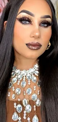 This live wallpaper features a striking woman with long, jet-black hair and a glittering necklace