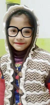 This charming live wallpaper showcases a young girl donning a cute hat and glasses